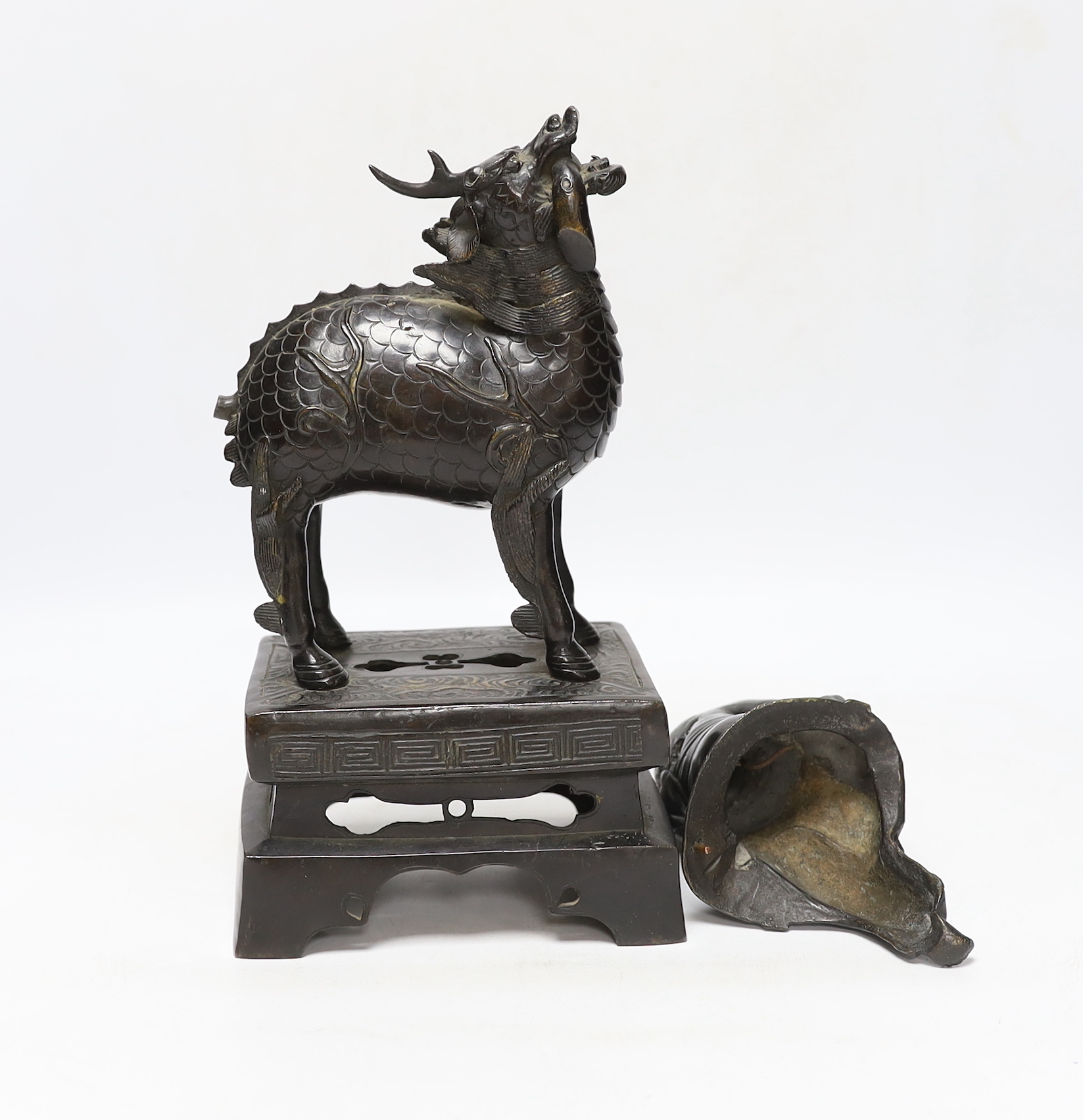 An 18th century Chinese bronze figure of a qilin together with a Japanese figural bronze mount, tallest 25cm